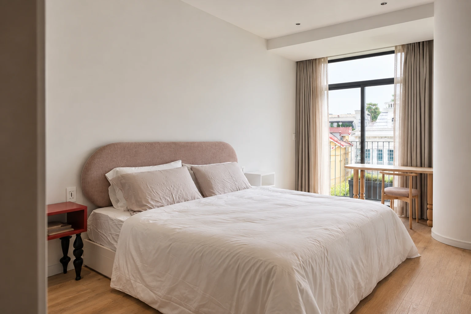 Main bedroom with upholstered headboard, balcony and workspace